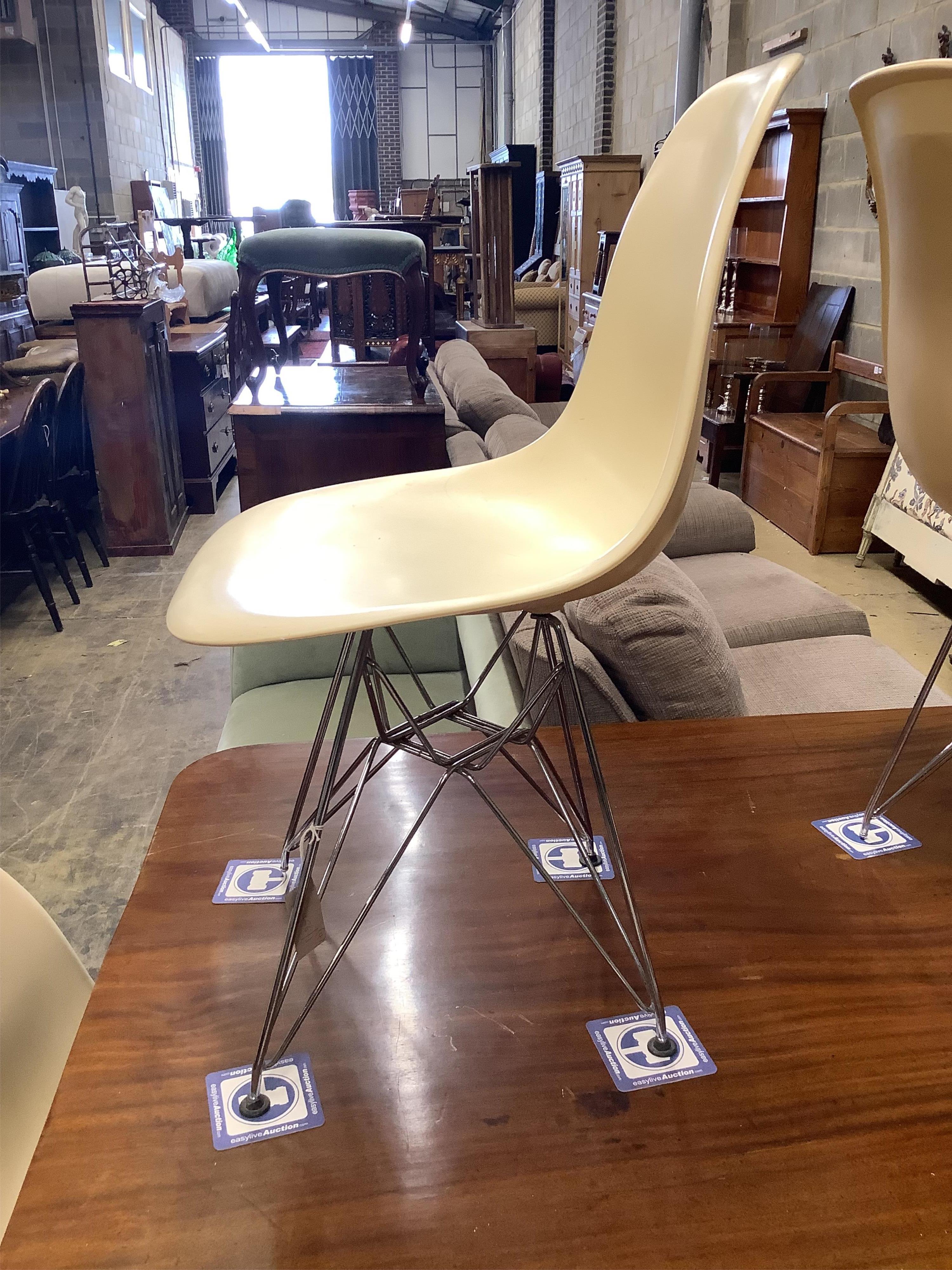 A set of four Eames fibre glass Eifel base chairs